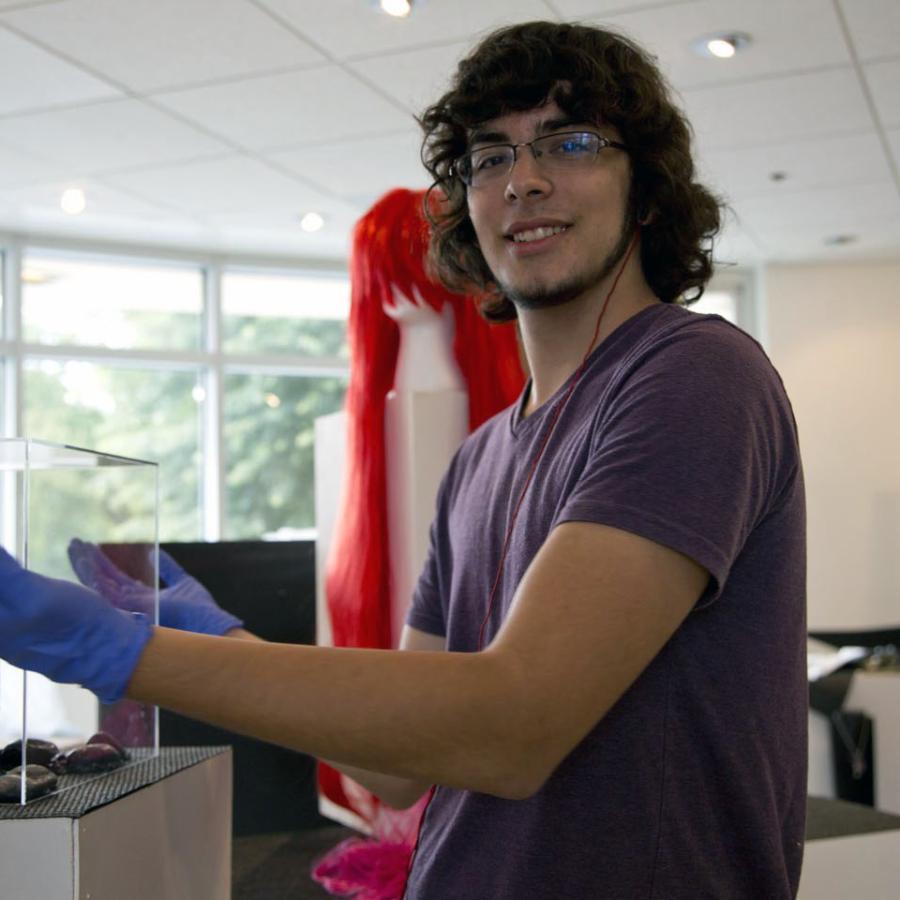 David polishing the show's acrylic cases