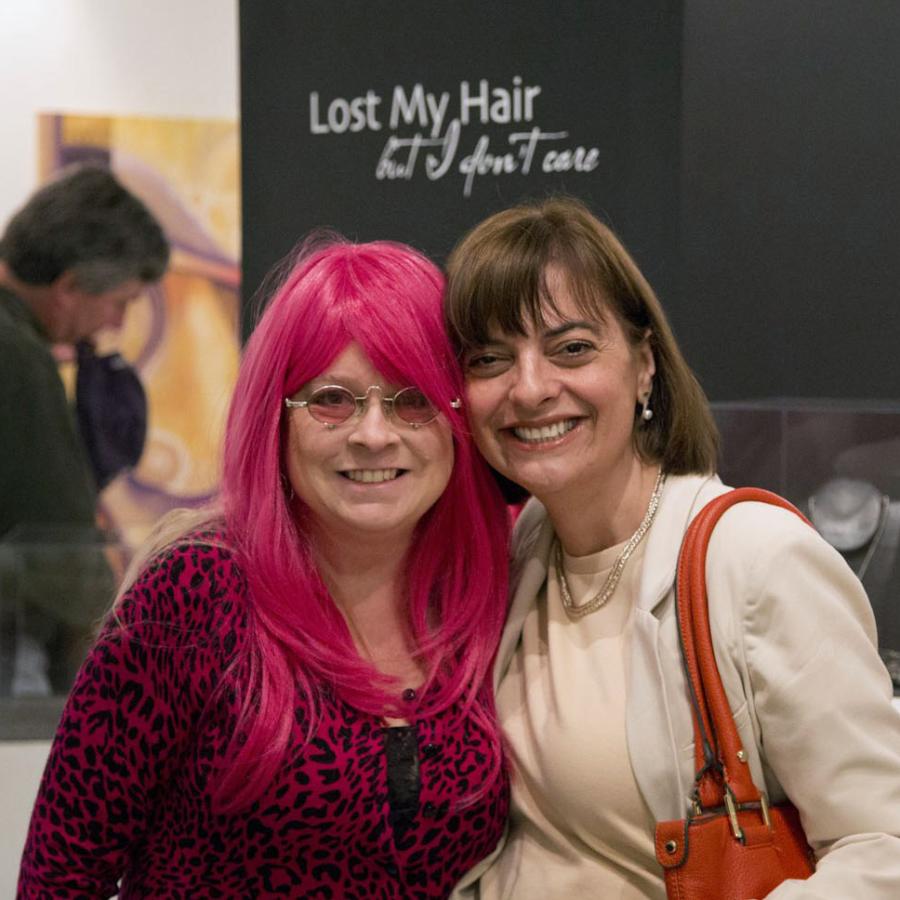 Blair with pink hair standing next to Elaine