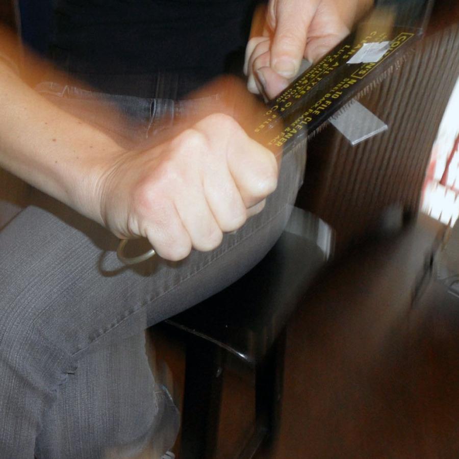 using a file brush to clean and sharpen files