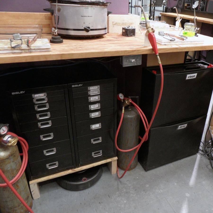 soldering station with drawers and roomba underneath