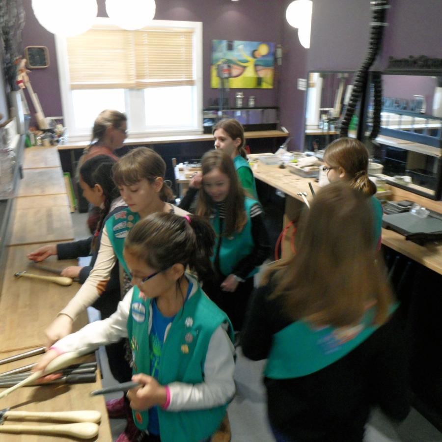 girl scouts gathered picking hammers