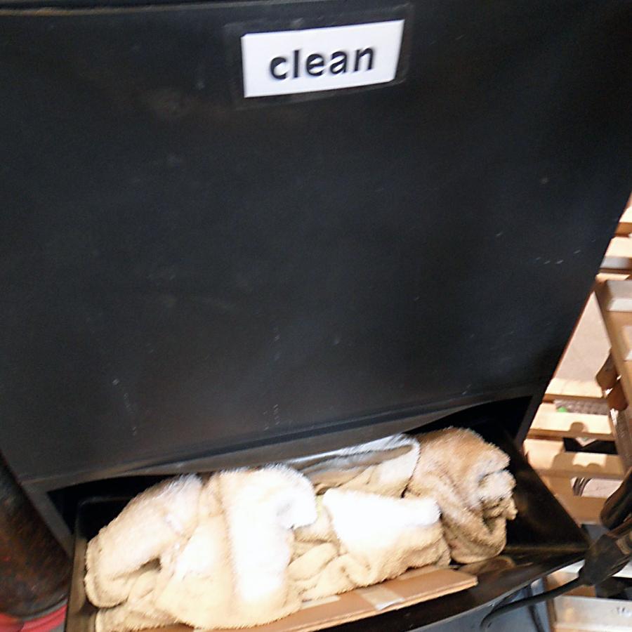 drawer labeled clean above separate drawer for dirty towels