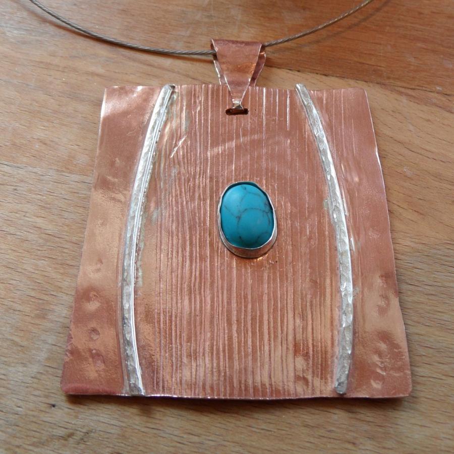 textured copper pendant with silver wire and turquoise stone
