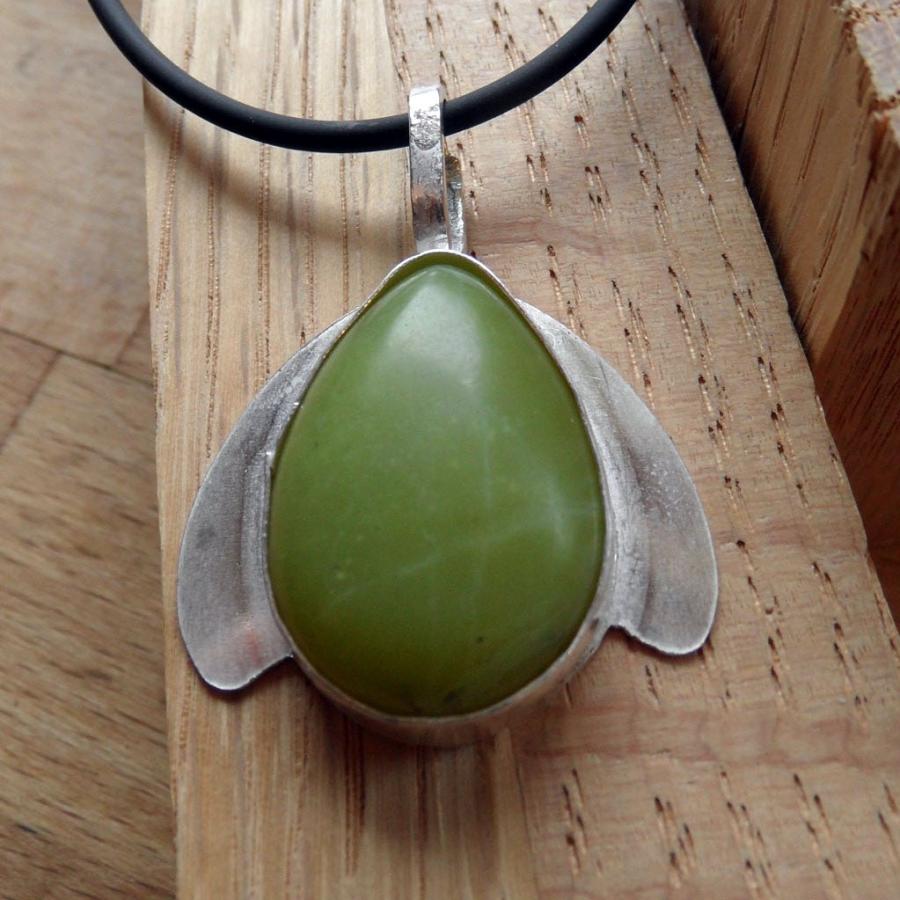 green stone set with silver wings pendant