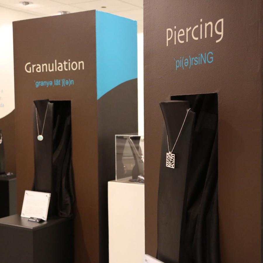 display towers showing pendants with piercing and granulation techniques