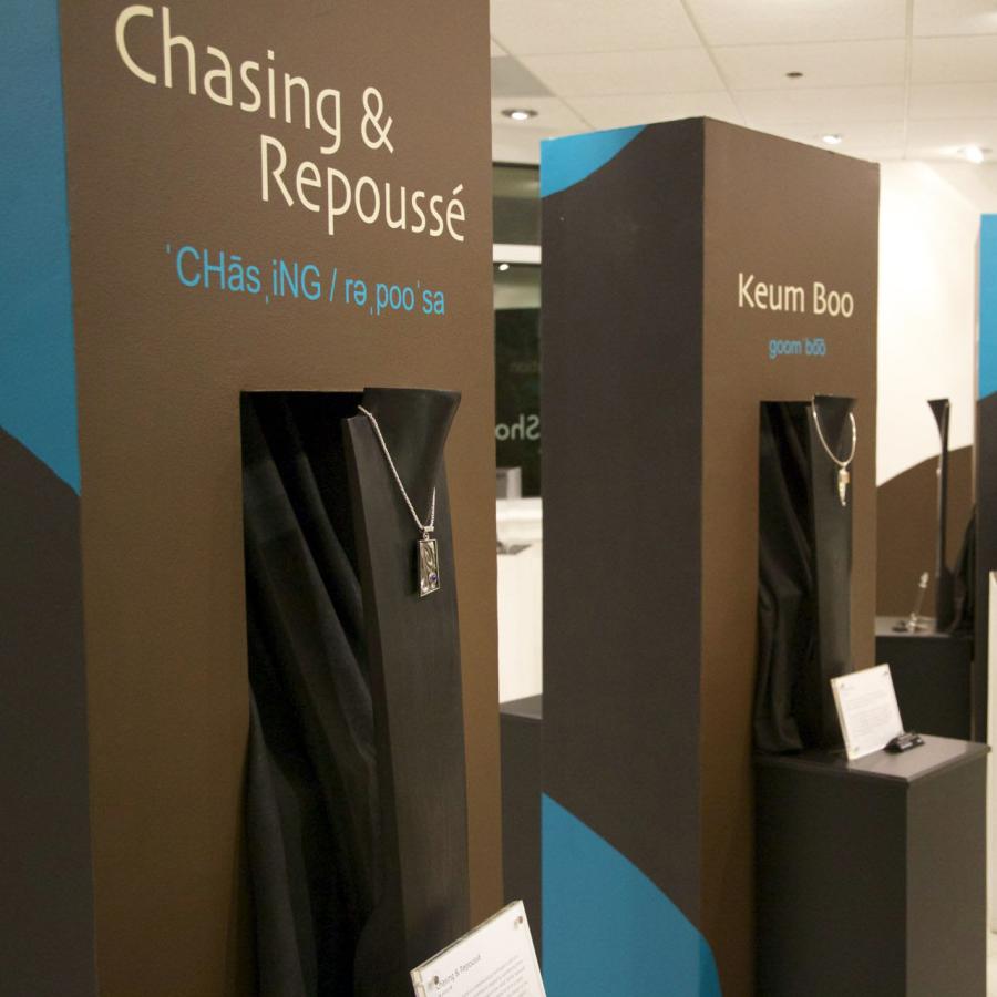 Display towers with chasing & repoussé and keum boo necklaces