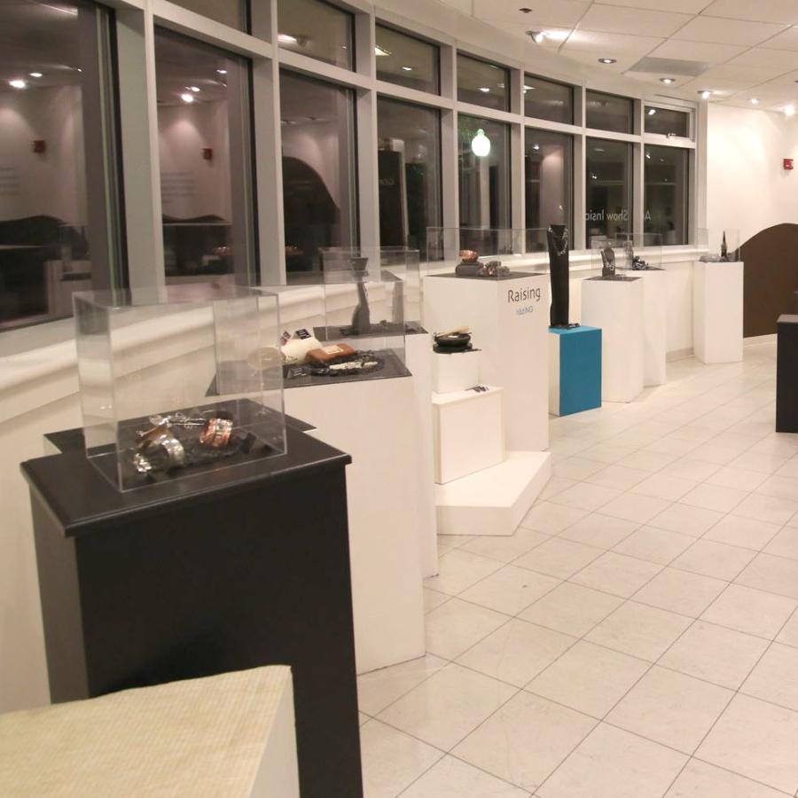 full shot of the gallery with towers and case displays next to windows