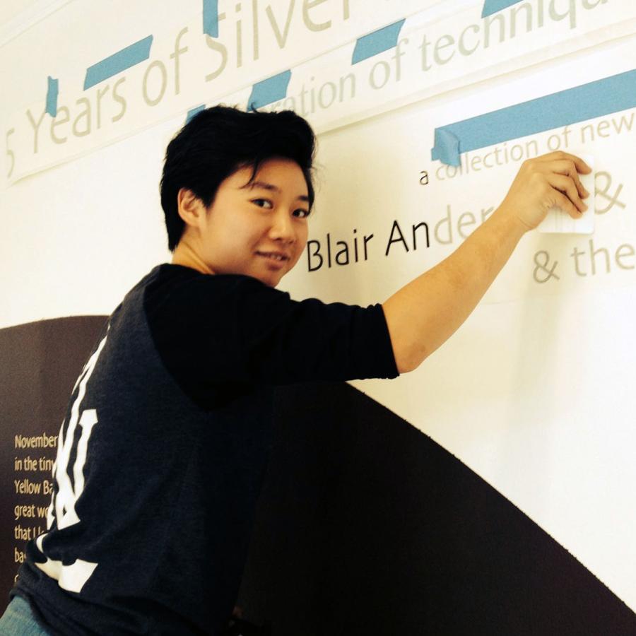 Kelly putting up vinyl text