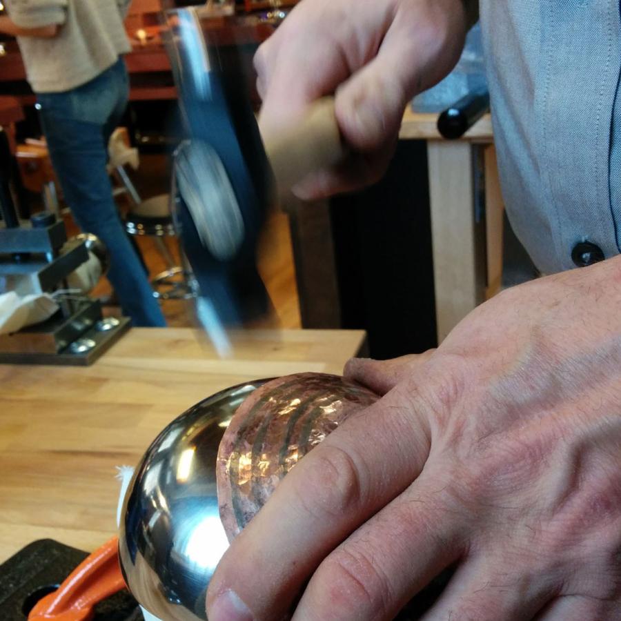 Vincent hammering copper on new stakes