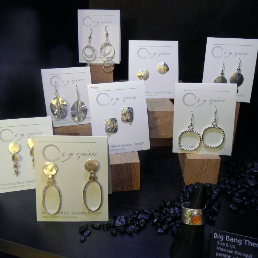 Silver and gold earrings on stock, by Elaine 