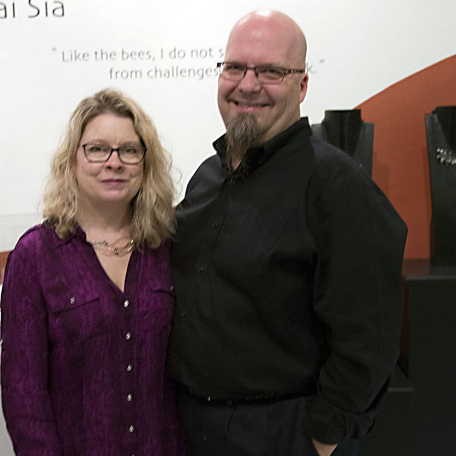 Blair and Bryan posing for photo at the show opening