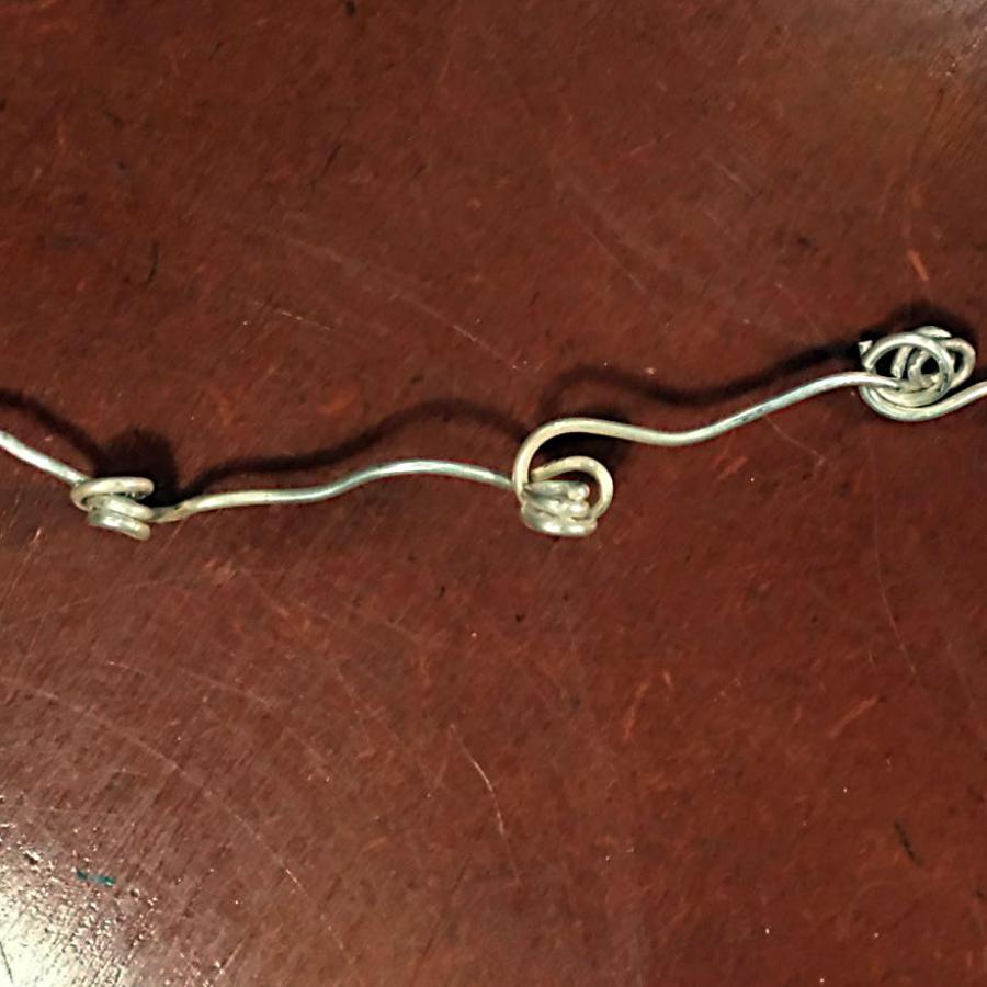 wire chain linked by swirls