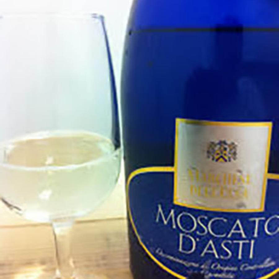 Blue moscato bottle with filled glass