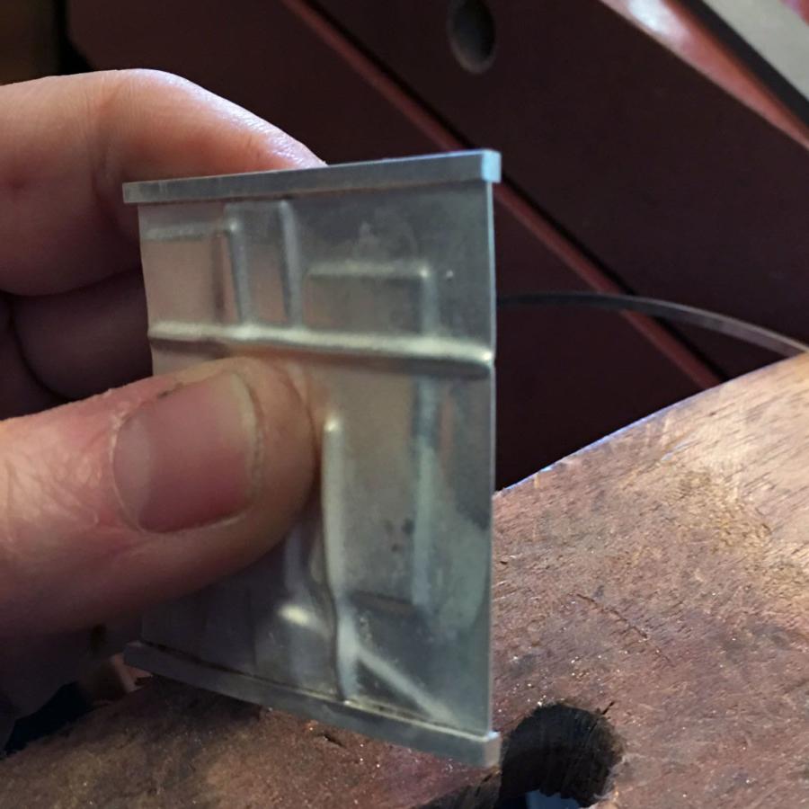 working on square panel of piece