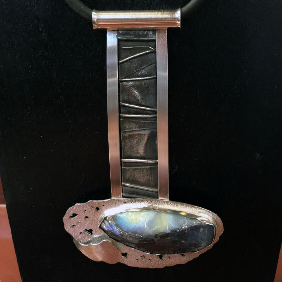 silver pendant with blue green stone