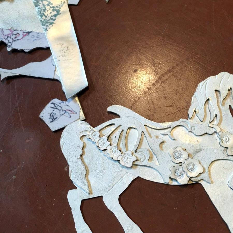 sawing out horse cutout in silver