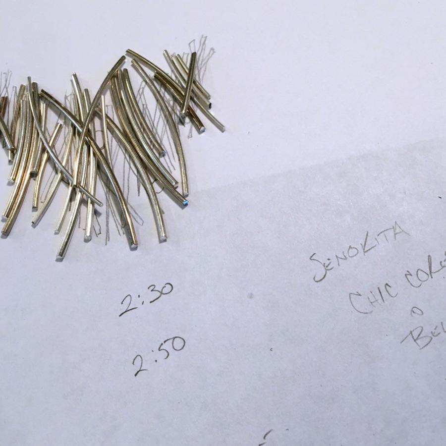 cluster of silver wire pieces on concept sketch paper