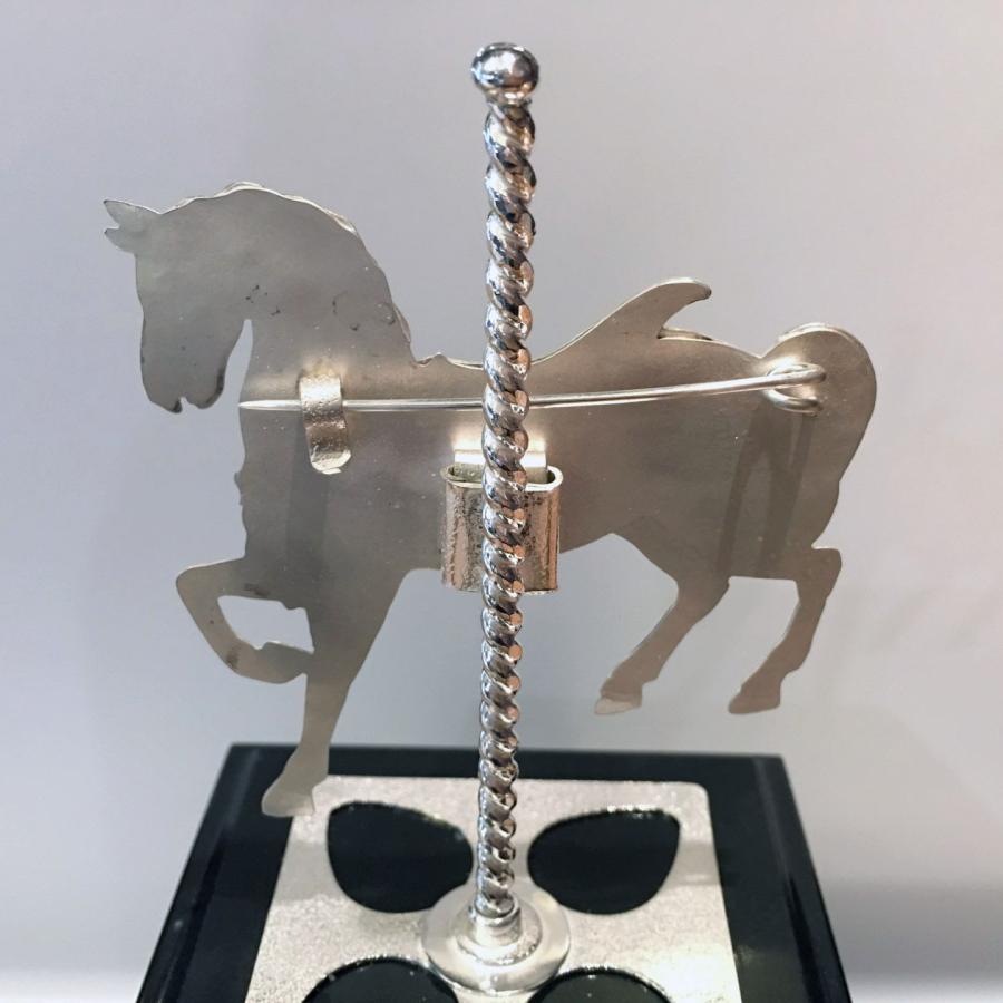 backside of award showing brooch pin 