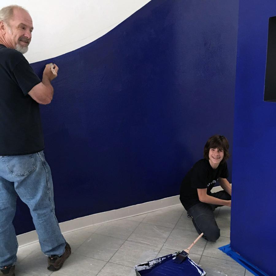 alan and louis painting the wall in lapis blue