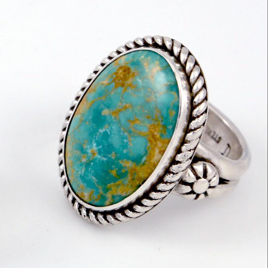 two decorative silver rings with blue and green turquoise 