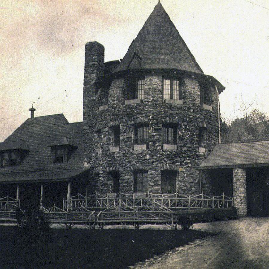 old picture of stone chataqua tower with pointed roof
