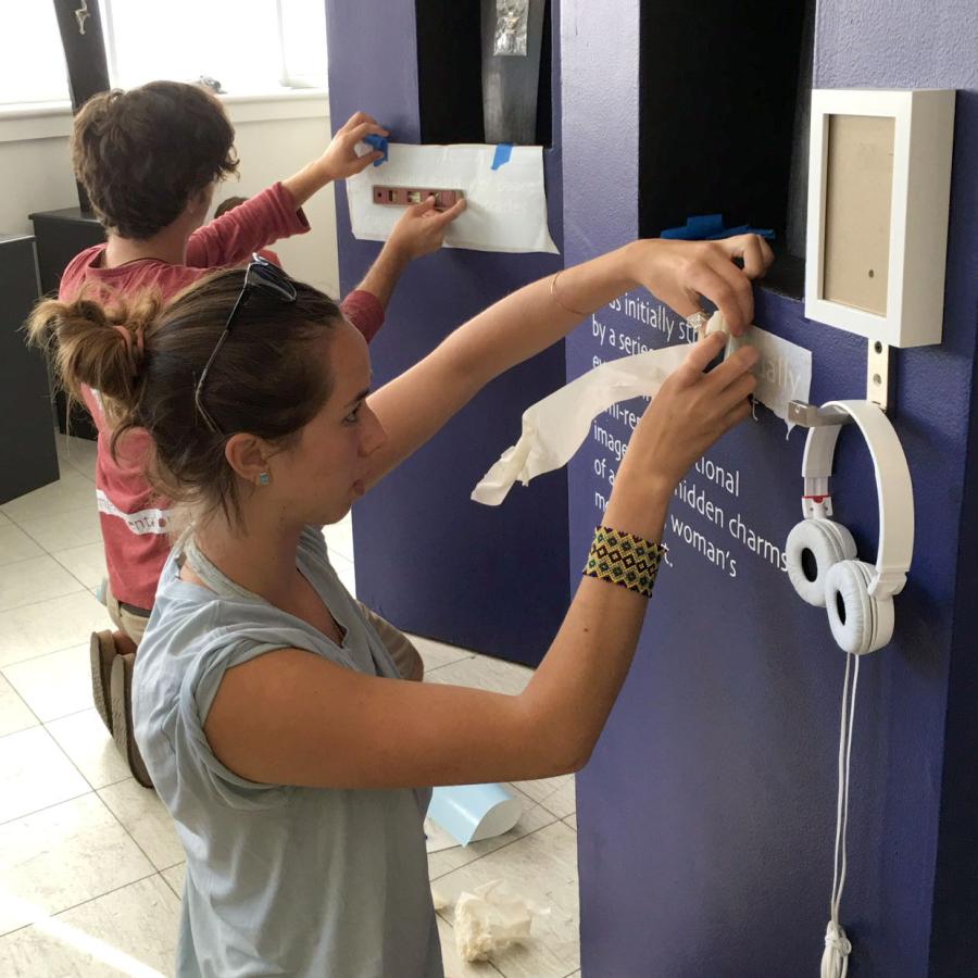 kaila and crispin putting up vinyl text