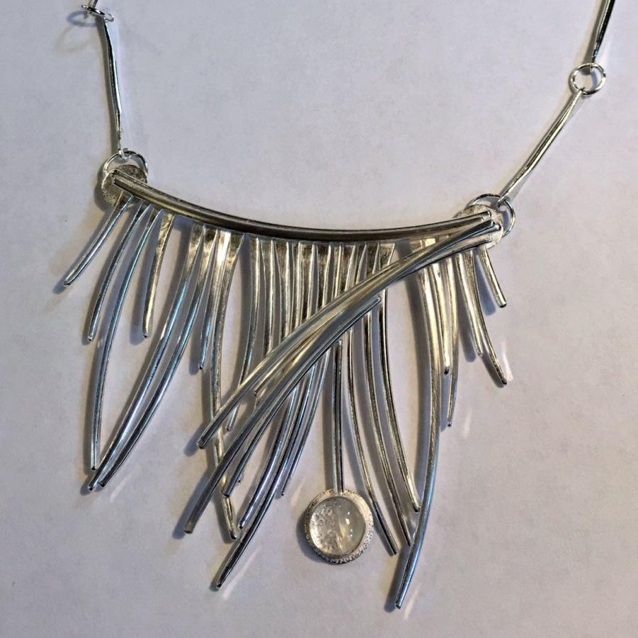 silver wire piece on dog bone chain