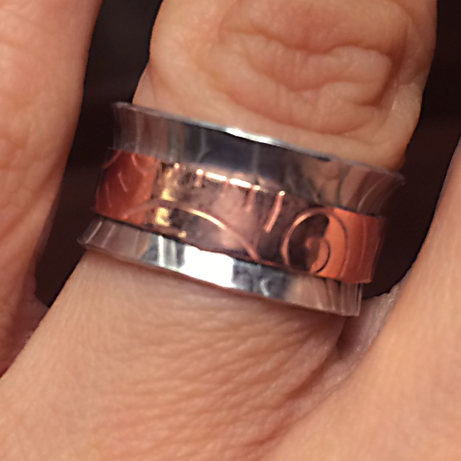 silver and copper spinner ring