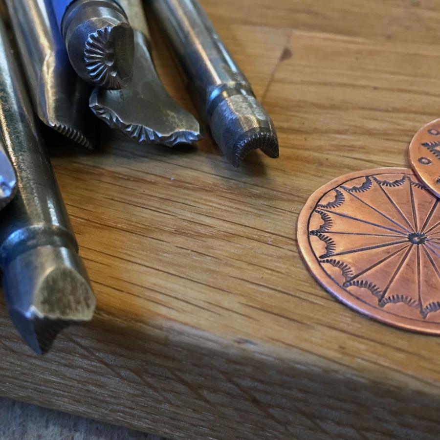 steel stamping tools next to copper samples