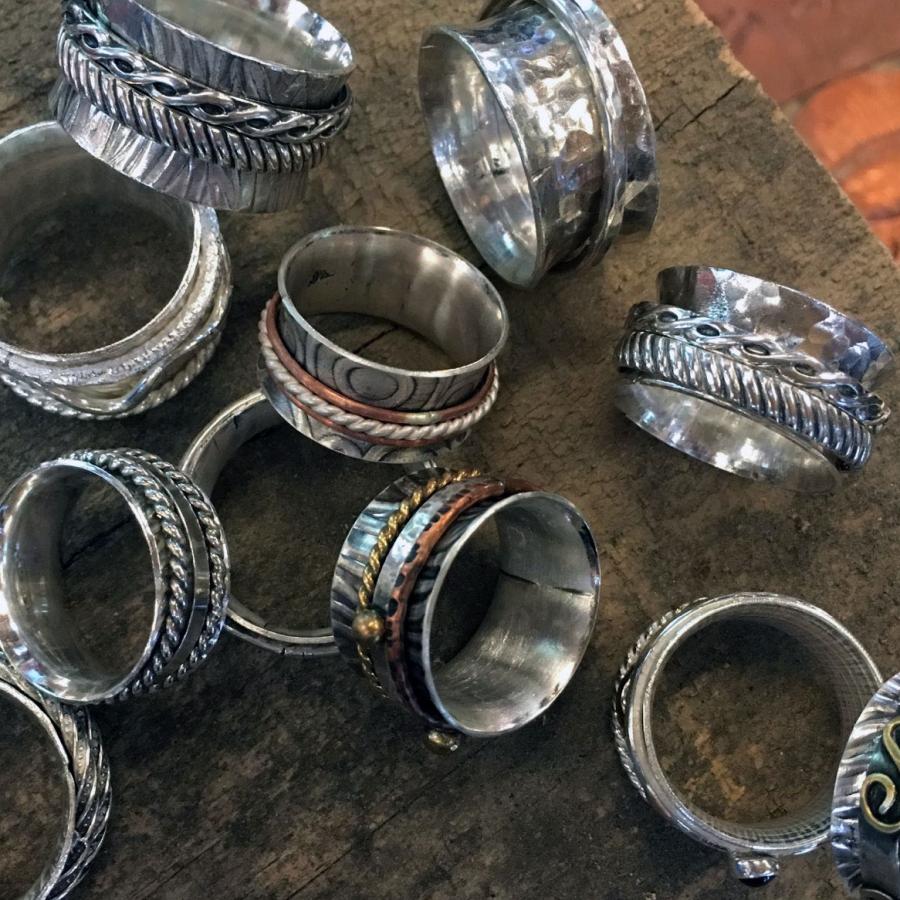 textured silver spinner rings with woven and copper inner bands
