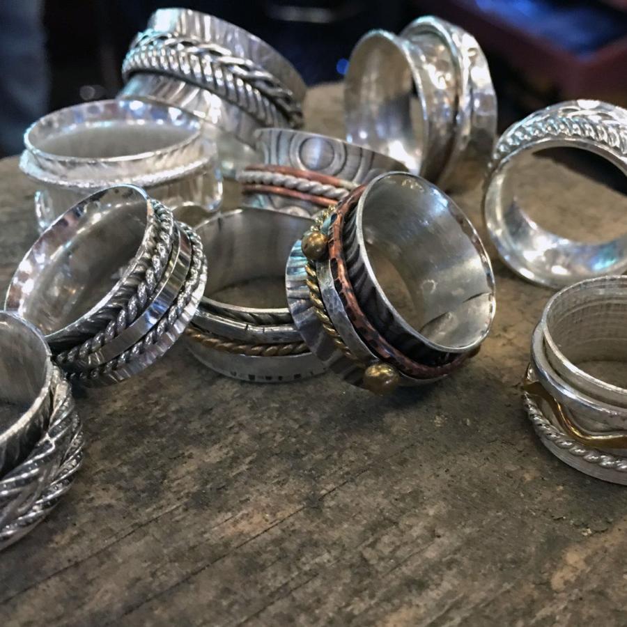 students' silver spinner rings piled up