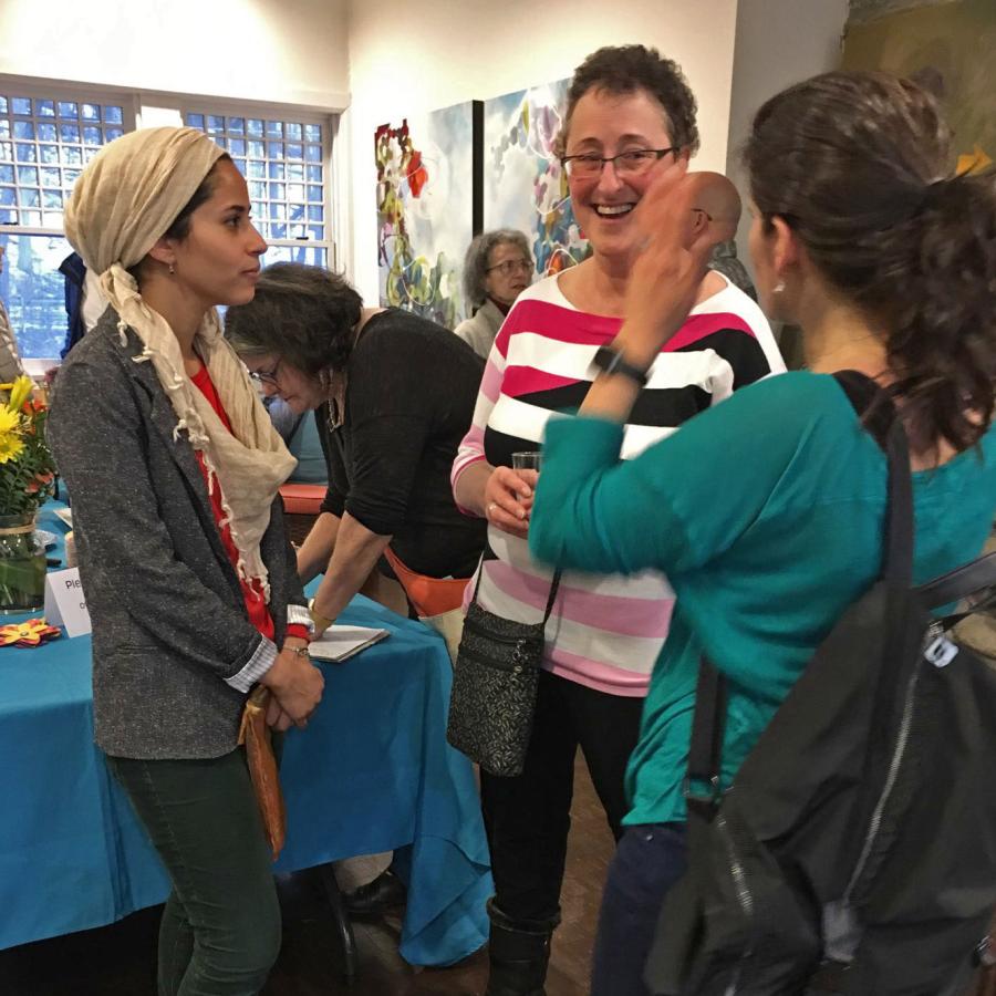 Mawadda chatting with people at the farewell party