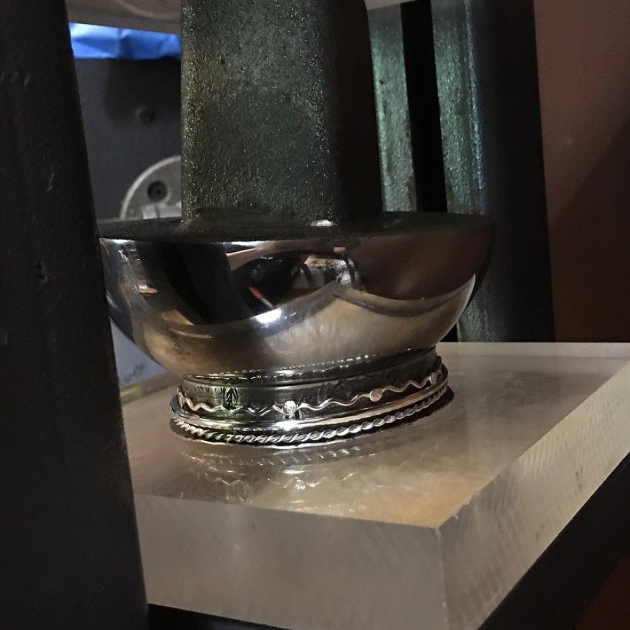 bangle being squished by mushroom stake