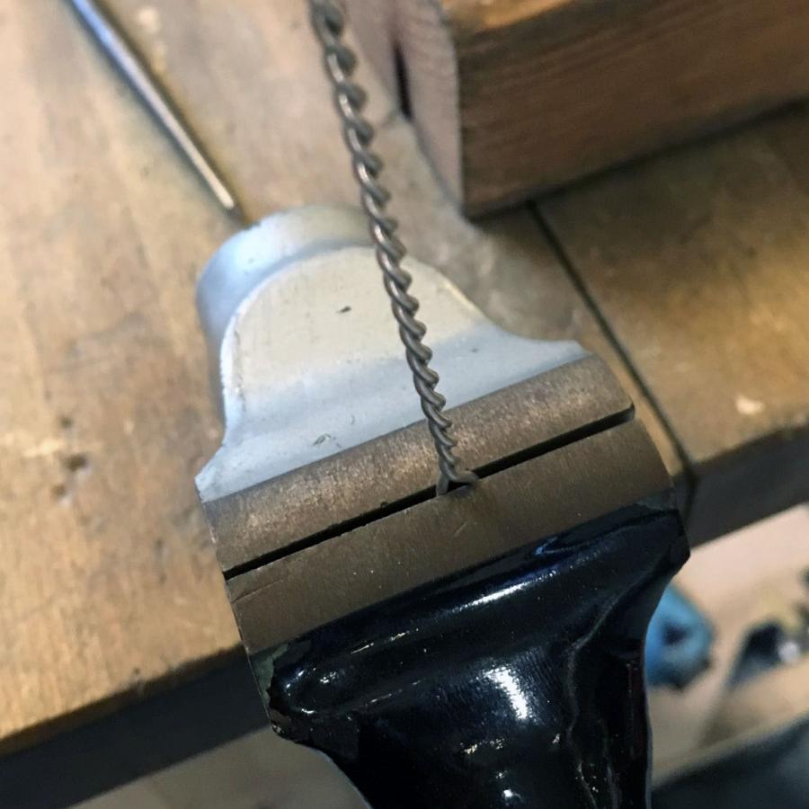 two wires clamped on one end and twisted