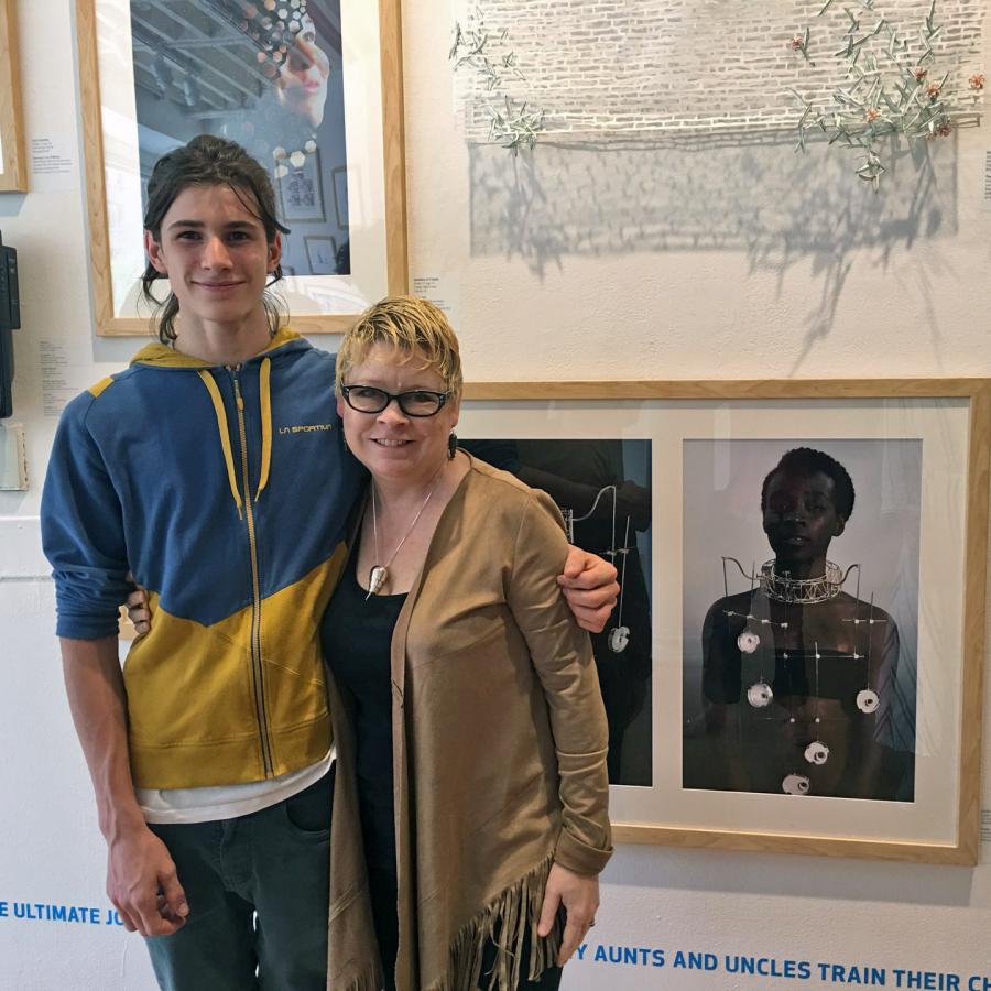 Blair and Louis in front of photo of "freeze"