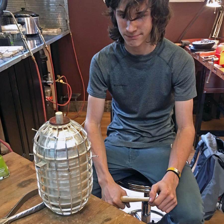 Louis looking at assembled but unfinished teapot