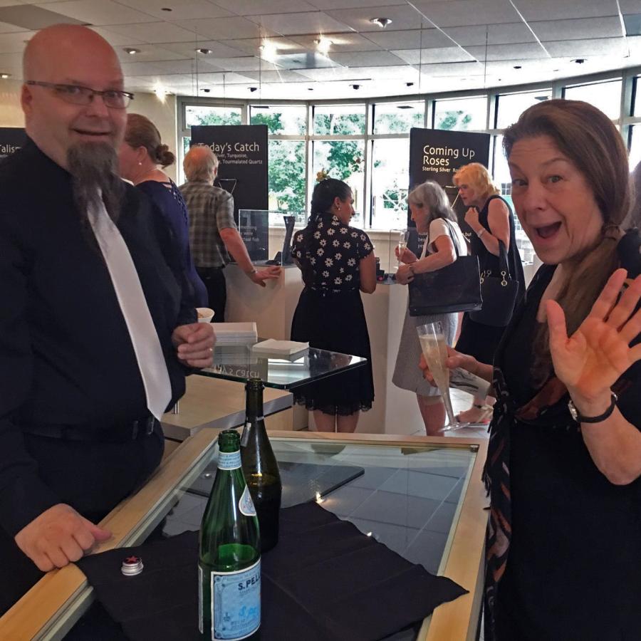 Bryan and Wendy with refreshments waving at the camera
