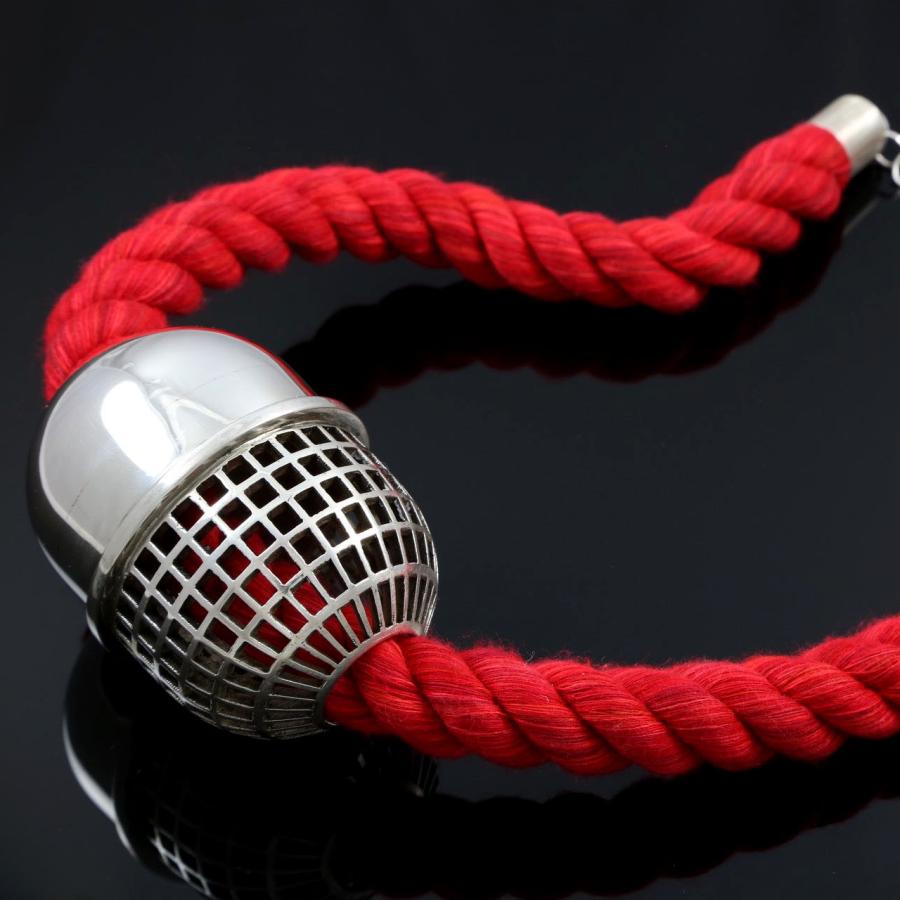 necklace with red rope and cage pill-like centerpiece 
