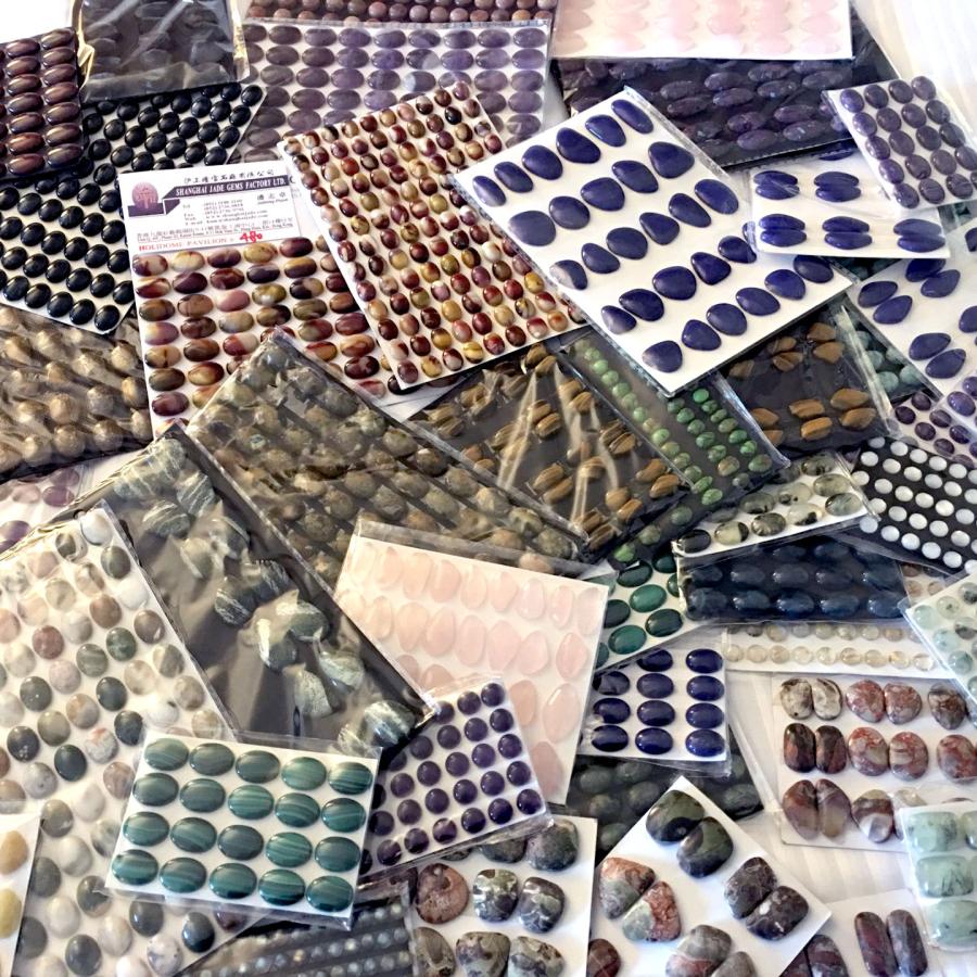 variety of cabochons on card backings 
