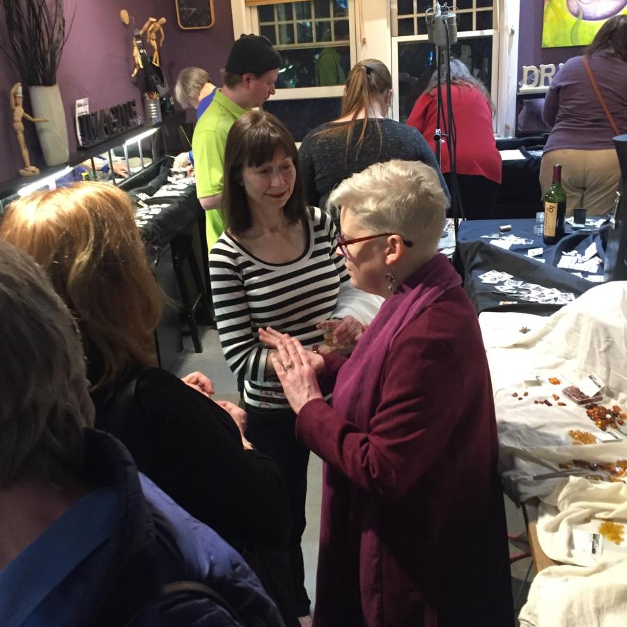 blair talking with gem show attendees in studio