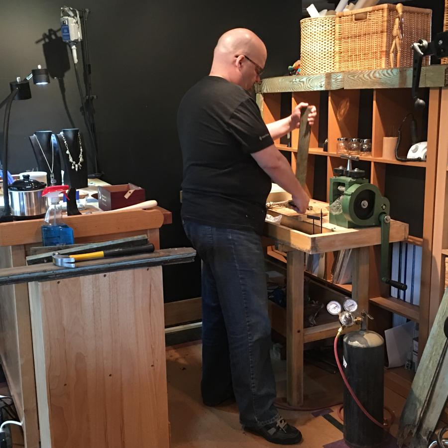 Bryan adding wood planks to studio setup for filming