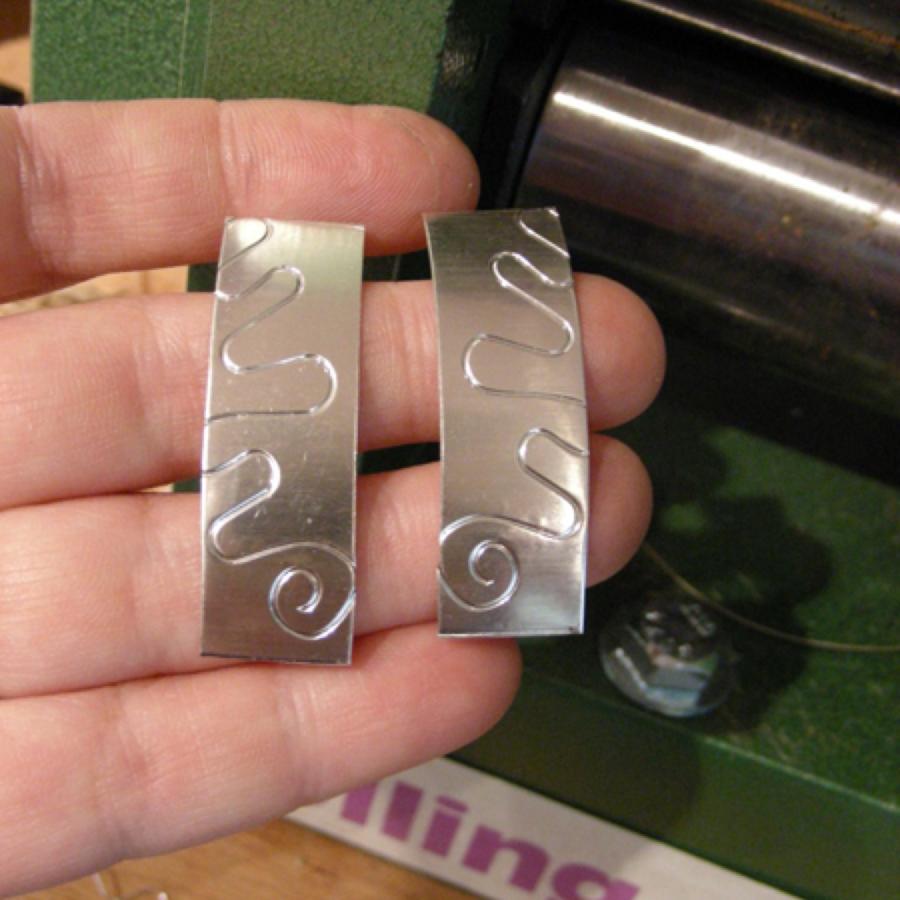 Silver with an embossed pattern