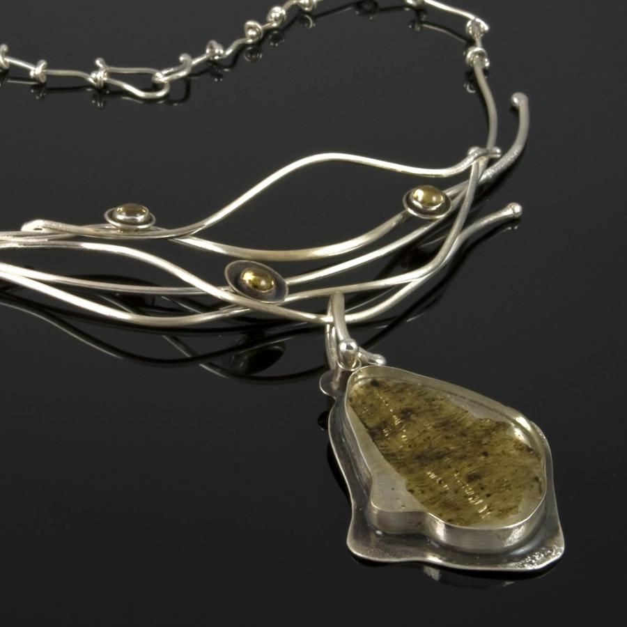 Silver pendent including Limu
