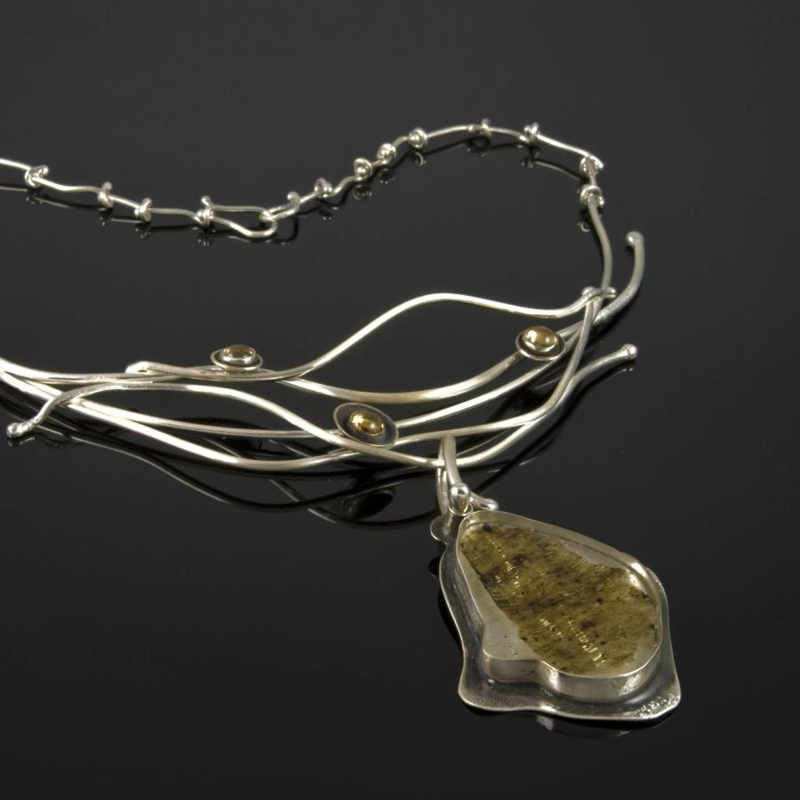Silver pendent including Limu