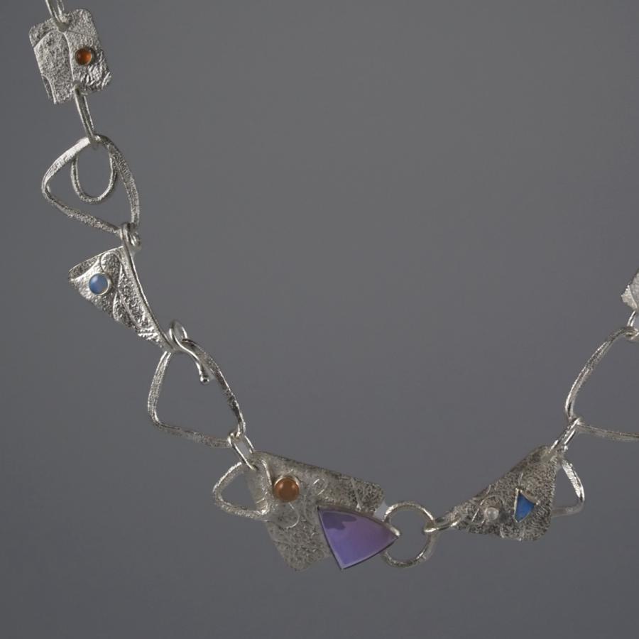 Silver chain with multiple stones