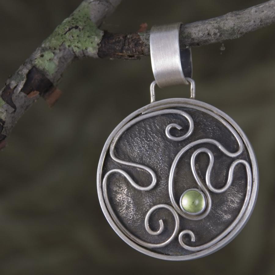 Back of Tree of Life pendant on a branch
