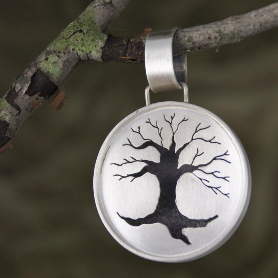 Front of Tree of Life pendant on a branch