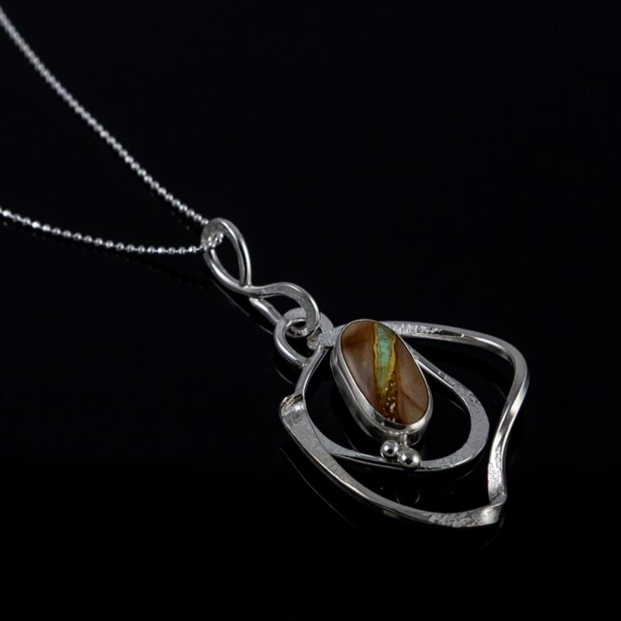 Silver pendant with brown and blue stone