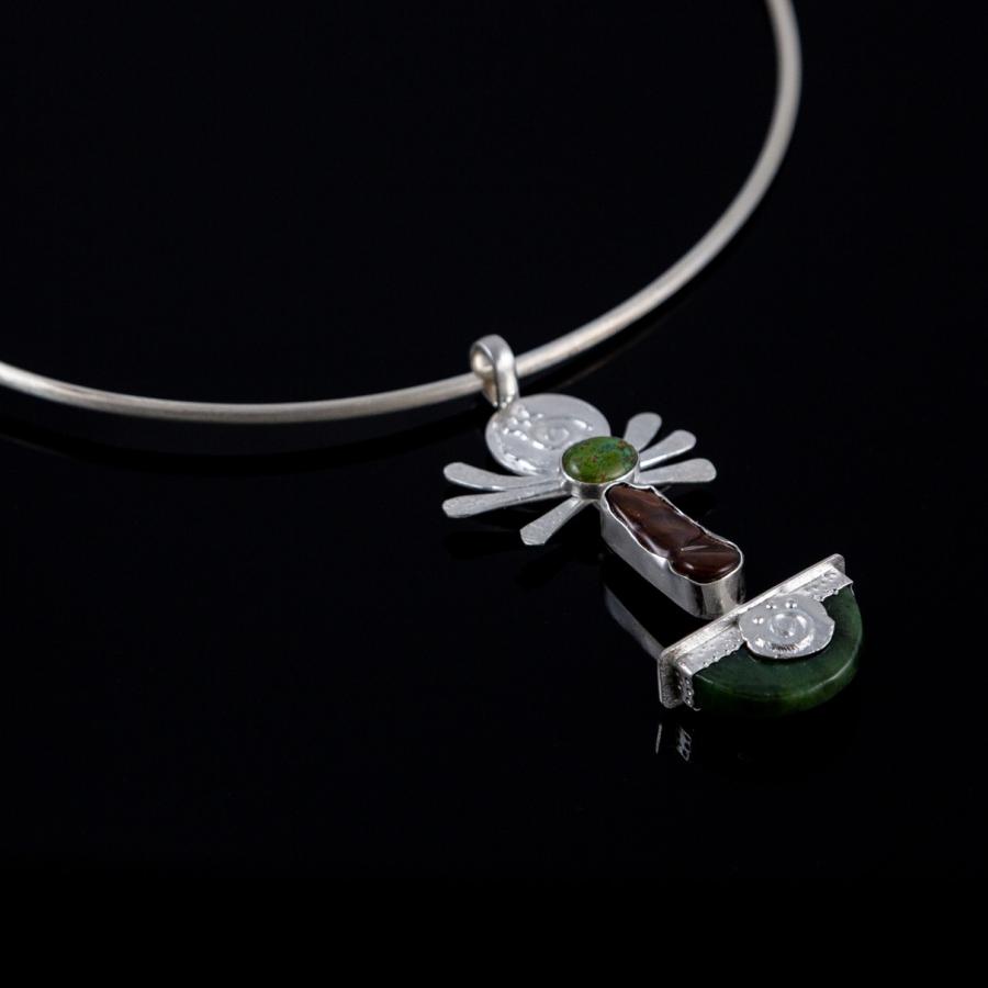 Silver pendant with green and brown stones