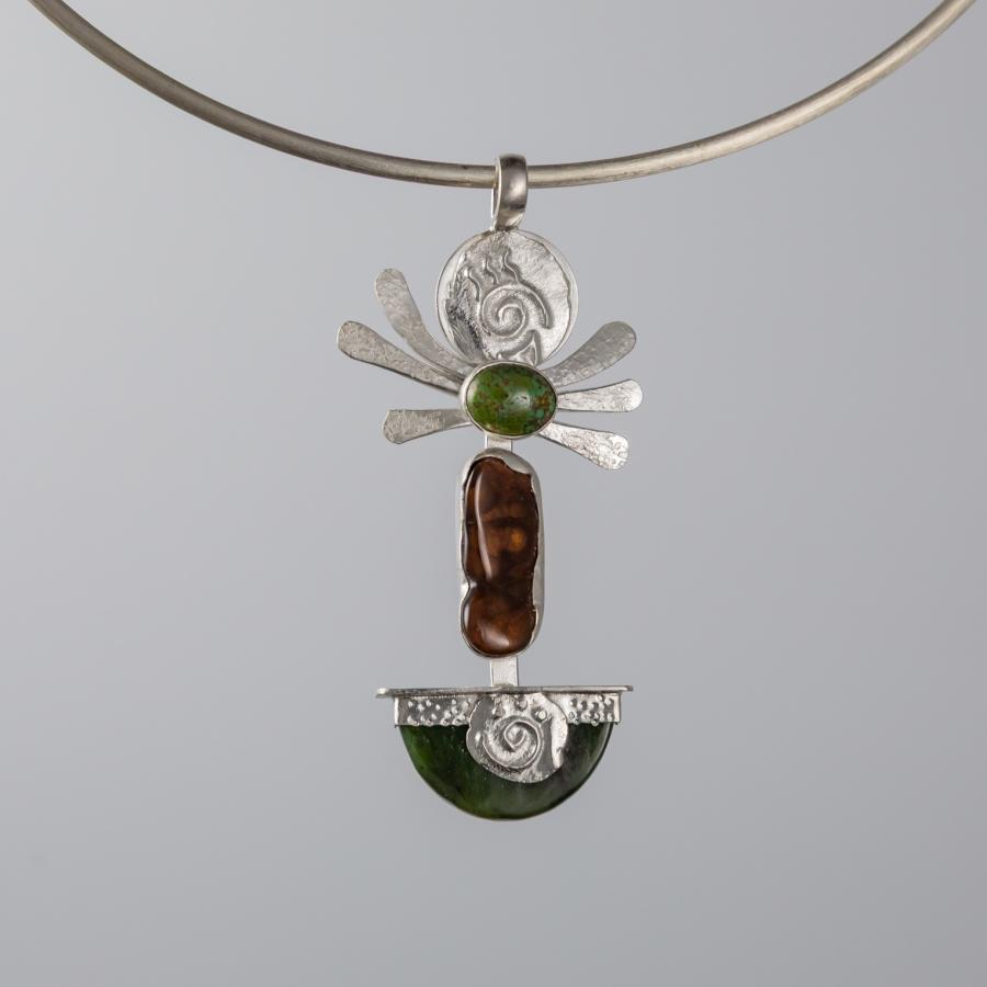 Silver pendant with green and brown stones